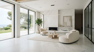 The Bianco Dolomiti White Dolomite features a crisp, serene white palette with ethereal gray veining in a minimalist living room setting.