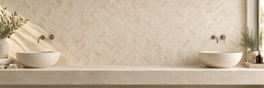 Ivory travertine herringbone mosaic tile on a bathroom vanity wall