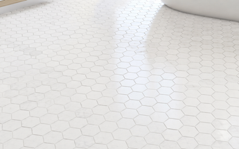 Thassos White marble hexagon mosaic tiles installed on a bright contemporary bathroom floor.