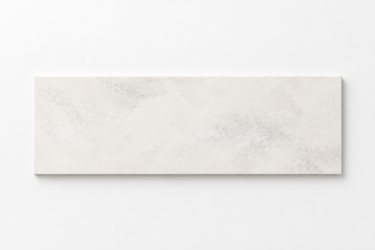 Single horizontal 4x12 Bianco Congelato dolomite tile with subtle gray natural movement
