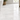 Pale Bianco Congelato 3x6 dolomite tiles installed in a running-bond bathroom floor