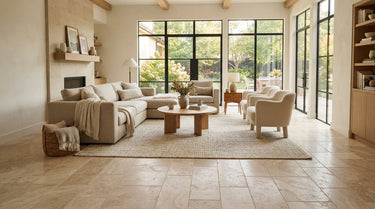 Our Living Room tile collection offers a cozy, attainable living space with natural stone flooring, styled with comfortable furniture and soft lighting to make it feel welcoming and practical.