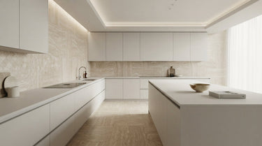 A modern kitchen showcasing Valerenga Travertine tiles as a sophisticated backsplash and floor section, featuring a serene palette of creamy beiges and soft tans with subtle natural veining, complemented by minimalist white cabinetry.