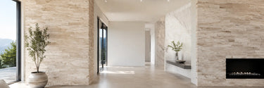 Ivory travertine ledger panels and white marble wall tile in a contemporary interior