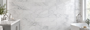 White marble subway tile wall in a bright contemporary bathroom