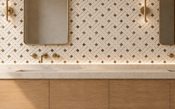 Crema Marfil Stanza marble mosaic with Emperador Dark square dots installed on a contemporary bathroom vanity wall.