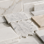 Natural marble tile collection featuring white, gray, beige, brown and green field tiles, mosaics and checkerboard patterns.