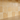 Close-up country style backsplash made with 4x4 tumbled gold yellow travertine tile above a countertop
