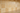 Close-up country style backsplash made with 4x4 tumbled gold yellow travertine tile above a countertop