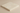 Close-up side angle of an Ivory Light 6x6 tumbled travertine tile