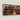 Emperador Dark single-step chair rail profile detail