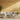 Gold/Yellow Travertine Manhattan Random-Strip Mosaic installed on a patio wall