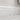 Bianco Congelato dolomite baseboard trim installed along a bathroom wall above the floor