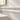 Bianco Congelato dolomite Milano molding installed horizontally as a decorative bathroom wall trim