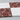Side-angle detail of separate Thassos White and Rosso Levanto marble tiles showing straight joints and stone edges