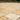 Gold yellow travertine Versailles pattern pavers installed on an outdoor patio