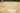 Gold yellow travertine Versailles pattern pavers installed on an outdoor patio